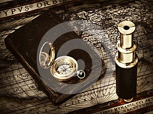 Vintage telescope and compass at antique map