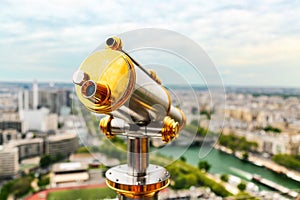 Vintage telescope monocular on top of Eiffel Tower, Paris, France.