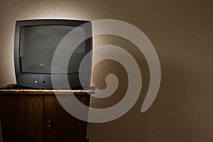 Vintage Television on wooden antique closet, old design