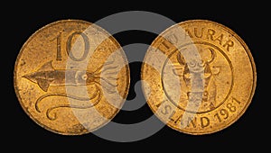 Vintage ten Aurar coins placed on a vibrant black background