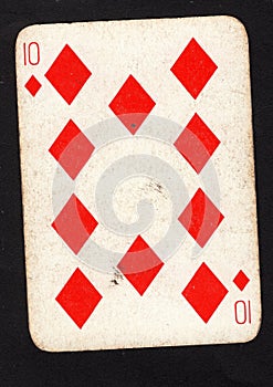 A vintage ten of diamonds playing card on a black background.