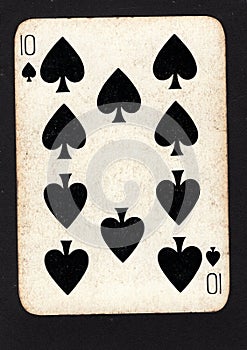 A vintage ten of spades playing card on a black background.