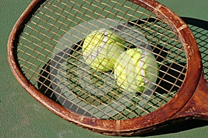 Vintage Tennis Racquet and Balls photo