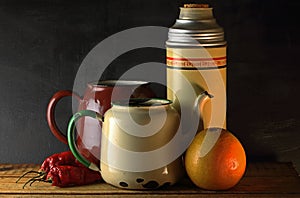 VINTAGE THERMOS FLASK AND ENAMEL KETTLES WITH FRUIT