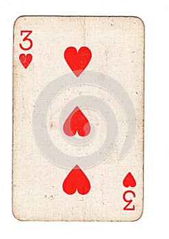 A vintage three of hearts playing card.