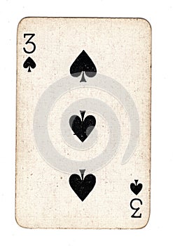 A vintage three of spades playing card.