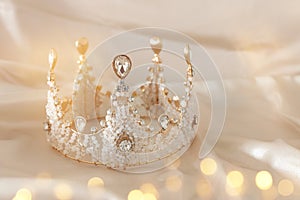 Vintage tiara over white delicate silk. Wedding concept