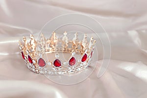 Vintage tiara over white delicate silk. Wedding concept