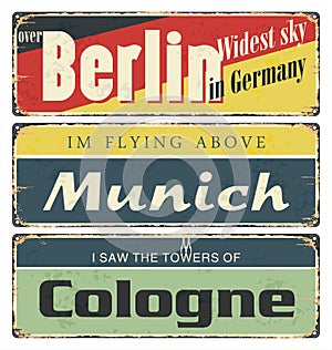 Vintage tin sign collection with Germany cities. Berlin. Munich. Cologne. photo
