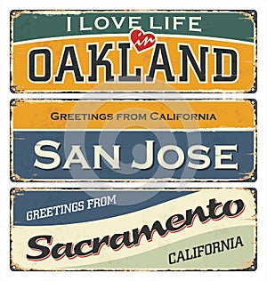 Vintage tin sign collection with USA cities. Oakland. San Jose. Sacramento. photo