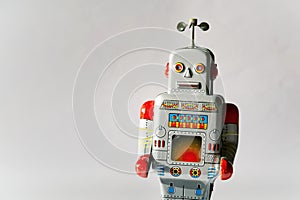 Vintage tin toy robot isolated, drone delivery artificial intelligence concept