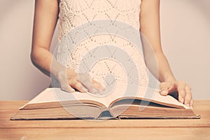 Vintage tone of A close-up of a christian woman reading the bible.