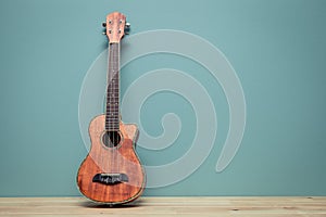 Vintage tone of still life with ukulele Old wall