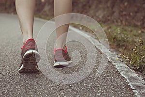 Vintage tone of woman walking towards unknown places