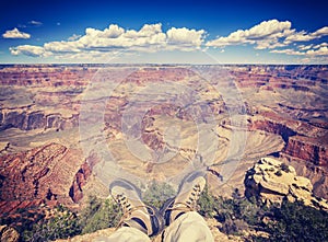 Vintage toned legs with old trekking shoes.