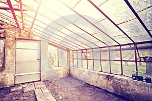 Vintage toned old empty glasshouse.