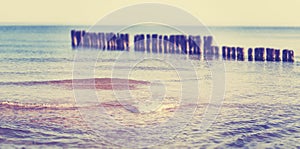 Vintage toned panoramic beach view with tilt shift effect.