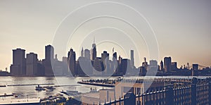 Vintage toned picture of New York City silhouette at sunset