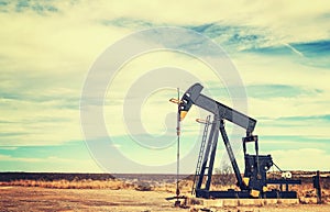 Vintage toned picture of an oil pump jack, Texas.