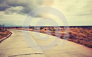 Vintage toned scenic road at sunset, travel concept, Baltra Island, Ecuador photo