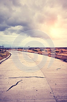 Vintage toned scenic road at sunset, travel concept, Baltra Island, Ecuador photo