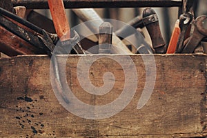 Vintage tool box on wood background