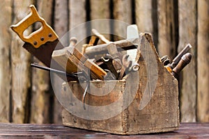 vintage tool box on wooden table, on wood background