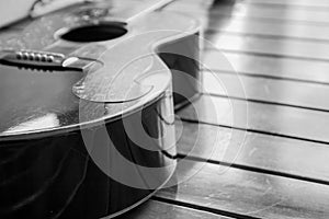 Vintage top guitar on old wood surface.