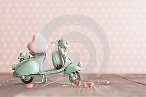 Vintage toy blue mototrcycle with pink heart