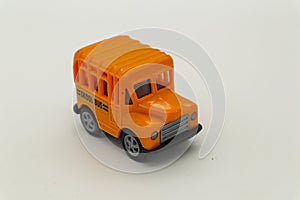 Vintage toy school bus on white background