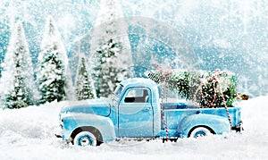 Vintage toy truck fetching a Christmas tree