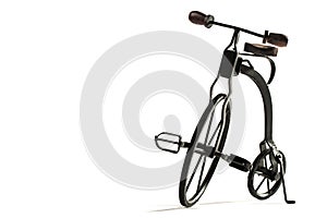 Vintage toy velocipede isolated in white