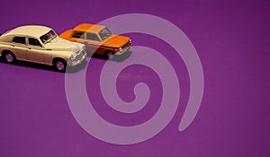 Vintage toycars on purple background photo