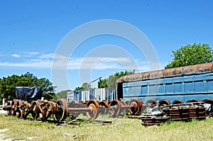 Vintage Train Car and Parts in Railyard