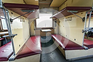 Vintage train interior with sleeping car seats