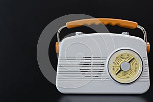 Vintage transistor radio on the black background