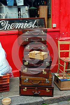 Vintage travel cases stacked on Portobello Road