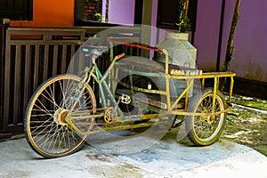 Vintage trishaw with antique milk churn