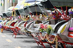 Vintage Trishaw stop beside road for service traveller