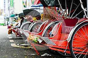 Vintage Trishaw stop beside road for service traveller