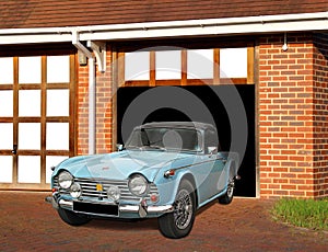 Vintage triumph tr4 sports car in garage