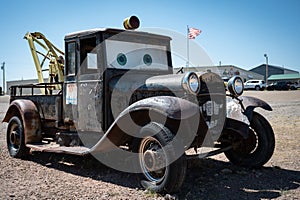 Vintage truck with Lightning Mcqueen eyes in a desert setting