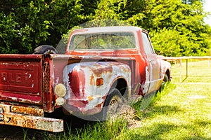 Vintage truck parked in a field on a farm