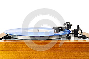 Vintage turntable with a blue vinyl isolated on white