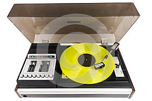 Vintage turntable record player with yellow vinyl