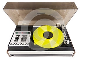 Vintage turntable record player with yellow vinyl