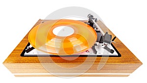 Vintage turntable with a red vinyl isolated on white