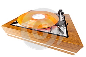 Vintage turntable with a red vinyl isolated on white