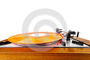 Vintage turntable with a red vinyl isolated on white