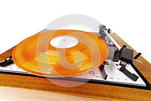 Vintage turntable with a red vinyl isolated on white